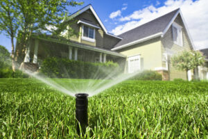 sprinkler head watering the lawn